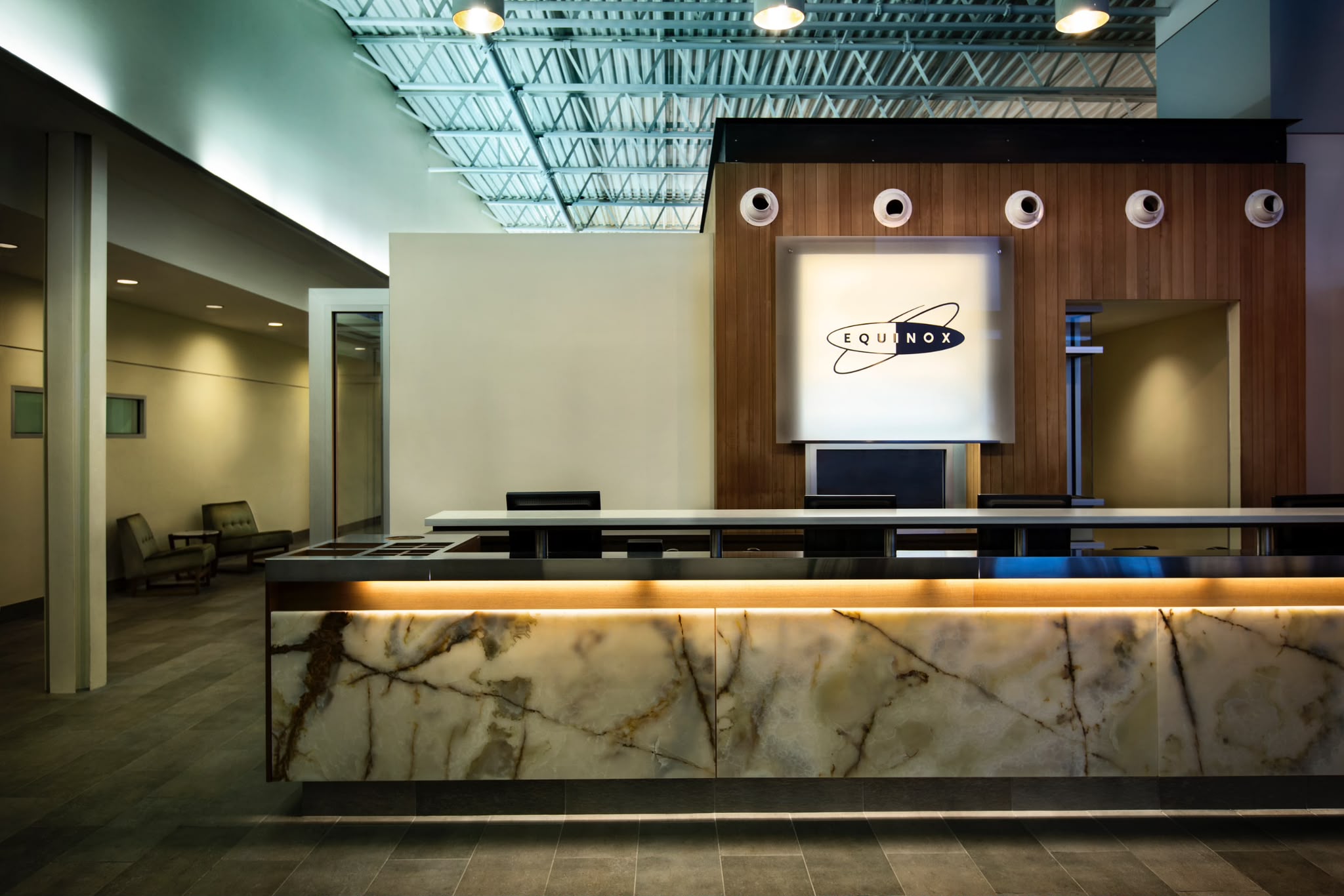 Equinox Scarsdale lobby with the brand logo and onyx front desk